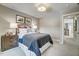 Charming bedroom with a navy blue bedspread and wooden nightstands at 9516 Woodriver Dr, Zebulon, NC 27597