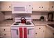 Close-up of kitchen stove, microwave, and countertops at 1004 Sandlin Pl # H, Raleigh, NC 27606