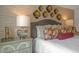 Bedroom with king bed, unique wall art, and accent wall at 110 Tobacco Woods Dr, Youngsville, NC 27596