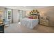 Spacious bedroom with large windows and brick accent wall at 110 Tobacco Woods Dr, Youngsville, NC 27596