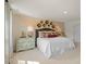 Spacious bedroom with a king-size bed and decorative wall at 110 Tobacco Woods Dr, Youngsville, NC 27596
