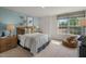 Cozy bedroom with a large window and beanbag chair at 110 Tobacco Woods Dr, Youngsville, NC 27596