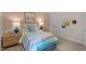Bedroom with colorful bedding, nightstands, and window at 110 Tobacco Woods Dr, Youngsville, NC 27596