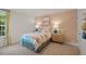 Bright bedroom with colorful bedding and a window with curtains at 110 Tobacco Woods Dr, Youngsville, NC 27596
