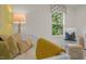 Bedroom with crib, rocking chair, and soft color palette at 110 Tobacco Woods Dr, Youngsville, NC 27596