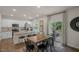 Bright dining area with hardwood floors and access to a deck at 110 Tobacco Woods Dr, Youngsville, NC 27596