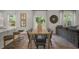 Kitchen and dining area with hardwood floors and sliding glass doors leading to a deck at 110 Tobacco Woods Dr, Youngsville, NC 27596