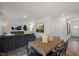 Dining area with a wooden table and chairs, view into living room at 110 Tobacco Woods Dr, Youngsville, NC 27596