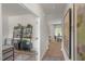 A view down a hallway, showing the home office and dining area at 110 Tobacco Woods Dr, Youngsville, NC 27596