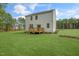 Two-story house with a deck and grassy yard at 110 Tobacco Woods Dr, Youngsville, NC 27596
