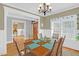 Spacious dining room featuring hardwood floors and a view into the kitchen at 2025 Stanchion St, Haw River, NC 27258