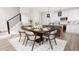 Dining area with wooden table, gray chairs, and a view into the kitchen at 312 Church St # 1, Morrisville, NC 27560