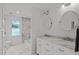 Clean bathroom with double vanity and marble countertops at 404 W Roanoke Park Dr, Raleigh, NC 27608