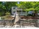 House exterior showcasing a stone wall and walkway at 404 W Roanoke Park Dr, Raleigh, NC 27608