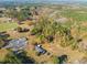 Aerial view showing house, expansive yard, and surrounding landscape at 5813 Cheek Rd, Durham, NC 27704