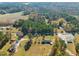 Aerial view showing house, expansive yard, and surrounding landscape at 5813 Cheek Rd, Durham, NC 27704