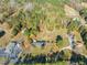 Aerial view showing house, expansive yard, and surrounding landscape at 5813 Cheek Rd, Durham, NC 27704