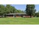 Ranch house on a spacious lot with mature trees at 5813 Cheek Rd, Durham, NC 27704