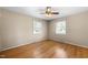 Well-lit bedroom with hardwood floors and ceiling fan at 5813 Cheek Rd, Durham, NC 27704