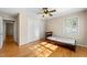 Bedroom with hardwood floors, double door closet and ceiling fan at 5813 Cheek Rd, Durham, NC 27704