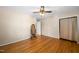 Bedroom with hardwood floors, ceiling fan and mirrored wardrobe at 5813 Cheek Rd, Durham, NC 27704