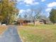 Front view of brick ranch house, long driveway at 5813 Cheek Rd, Durham, NC 27704