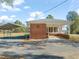Brick ranch house with covered porch and carport at 5813 Cheek Rd, Durham, NC 27704