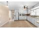 Kitchen with white cabinets and tile floor at 5813 Cheek Rd, Durham, NC 27704
