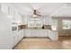 Galley kitchen with white cabinets and tile floor at 5813 Cheek Rd, Durham, NC 27704