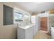 Laundry room with washer, dryer, and access to sunroom at 5813 Cheek Rd, Durham, NC 27704