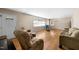 Spacious living room with hardwood floors and large windows at 5813 Cheek Rd, Durham, NC 27704