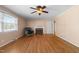Living room featuring hardwood floors, fireplace and ceiling fan at 5813 Cheek Rd, Durham, NC 27704