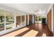 Bright sunroom features tile flooring and sliding glass doors at 5813 Cheek Rd, Durham, NC 27704