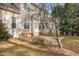 Home's exterior showcasing a patio and a sunroom at 1620 Dunn Rd, Raleigh, NC 27614