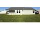 Home's exterior back view, showcasing a grassy backyard at 198 Pate Landing Dr, Selma, NC 27576