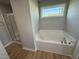 Bathroom with soaking tub, shower, and double vanity at 198 Pate Landing Dr, Selma, NC 27576