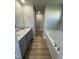 Bathroom with double vanity, granite countertops, and garden tub at 198 Pate Landing Dr, Selma, NC 27576