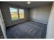 Bright bedroom with carpeted floors and large windows at 198 Pate Landing Dr, Selma, NC 27576