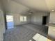Open living room with hardwood floors and access to the front porch at 198 Pate Landing Dr, Selma, NC 27576
