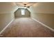 Spacious bonus room with carpeted floor and ceiling fan at 203 Long Grass Dr, Smithfield, NC 27577