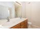 Bathroom with double vanity, large mirror, and shower at 2124 Star Sapphire Dr, Raleigh, NC 27610