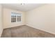 Simple bedroom with carpeted floor and a large window at 2124 Star Sapphire Dr, Raleigh, NC 27610