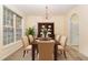 Formal dining room featuring a wooden table, six chairs, and a large hutch at 2124 Star Sapphire Dr, Raleigh, NC 27610