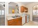 View of kitchen with wood cabinets, stainless steel appliances, and tile floor at 2124 Star Sapphire Dr, Raleigh, NC 27610