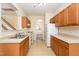 Bright kitchen with light wood cabinets, stainless steel appliances, and tile flooring at 2124 Star Sapphire Dr, Raleigh, NC 27610