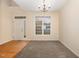 Bright living room with hardwood and carpeted floors, and a view to the front door at 2124 Star Sapphire Dr, Raleigh, NC 27610