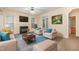 Living room with fireplace, two armchairs, and a sofa. Access to a small bathroom at 2124 Star Sapphire Dr, Raleigh, NC 27610