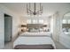 Spacious bedroom with king-size bed and stylish chandelier at 2729 Hunter Woods Dr # 568, Apex, NC 27502