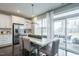 Kitchen dining area with a table for six and sliding glass doors leading to a patio at 2729 Hunter Woods Dr # 568, Apex, NC 27502