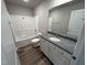Bathroom features a granite vanity, a bathtub, and vinyl flooring at 29 Pate Landing Dr, Selma, NC 27576